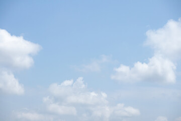 Fototapeta premium Beautiful blue sky with white clouds on a sunny day background