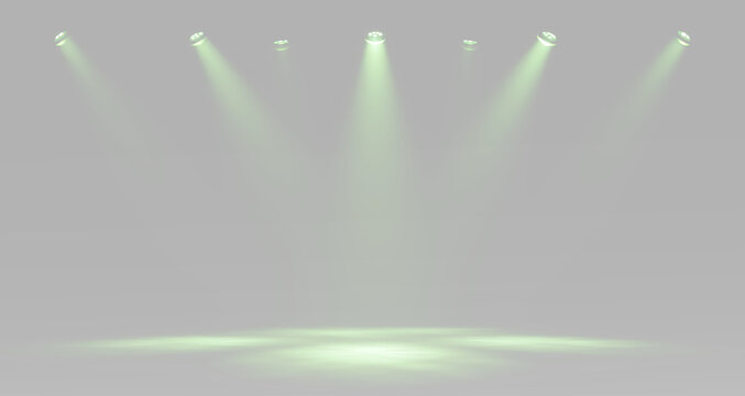 Green theatrical spotlights arranged in a row and illuminating the central stage with powerful glowing beams