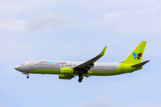 Fukuoka, Japan - August 8, 2026: Jin Air Boeing 737-800 (HL8242) coming in to land against a pale blue sky
