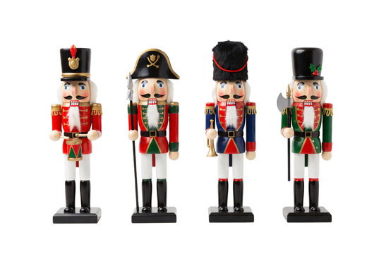 Four traditional wooden nutcracker figures dressed in colorful military and pirate uniforms.