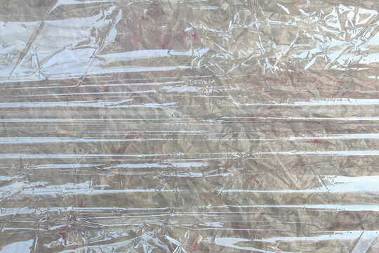 Abstract Background Texture of Pulled and Crumpled Clear Plastic Wrapping
