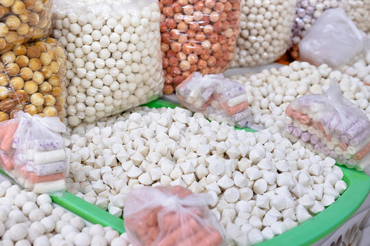 Traditional dried dairy cheese balls  - kurt displayed at an oriental bazaar in Bukhara, Uzbekistan. Ideal for travel, food culture, or market-themed projects.