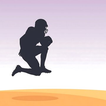 American football player crouching to catch a ball on orange field