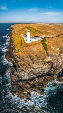 Panorama of Cliffs and Trevose Head Lighthouse from a drone, Padstow, Cornwall, England, United Kingdom