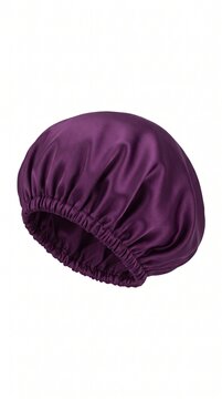 A luxurious purple silk sleep bonnet for hair protection during rest. This satin cap helps maintain hairstyles and prevent frizz as part of a healthy bedtime ritual. Isolated on white.