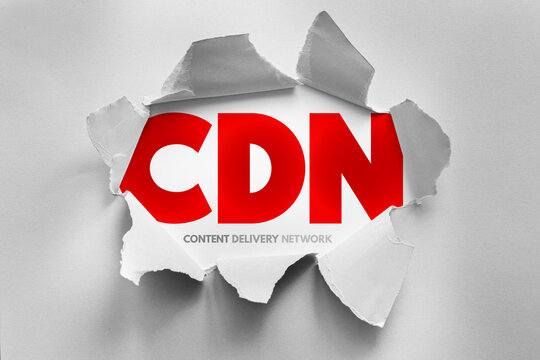 CDN Content Delivery Network text shown through torn paper design, internet technology concept representing distributed servers, web performance optimization and global data delivery