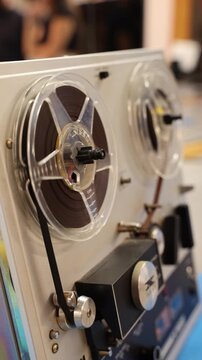Vintage reel-to-reel audio tape recorder playing