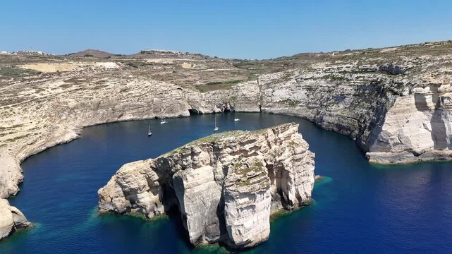 Cinematic Aerial Drone Shot of Dramatic Limestone Cliffs and Turquoise Sea at Dwejra Bay Gozo Malta
