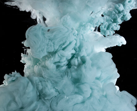Swirling colors blend in water creating dynamic shapes
