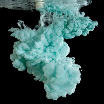 Swirling colors blend in water creating dynamic shapes