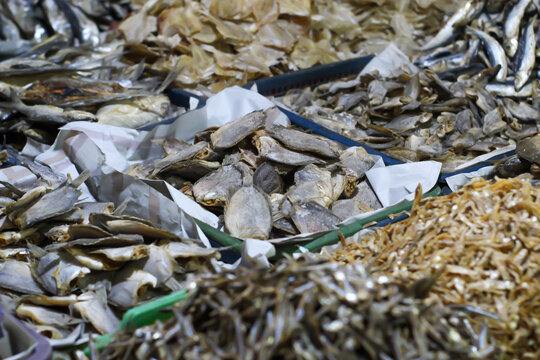 A pile of raw dried anchovies sold at a traditional Indonesian market