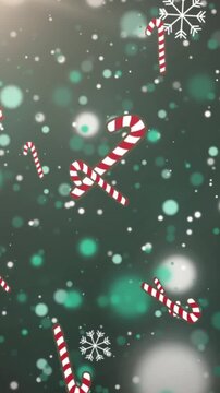 Animation of snow and christmas candy canes falling over green background