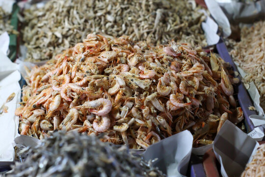 Piles of dried ebi (dried shrimp) and salted fish at the traditional market