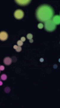 Animation of glowing light spots over dark background