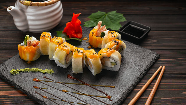 Sushi rolls with shrimp on slate