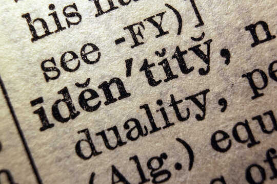 Word identity printed on dictionary page, macro close up