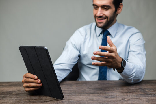 
Man smiles while holding a tablet
6 | 33