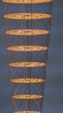 Rotating Gold Plate Stack of a Quantum Computer Dilution Refrigerator With Spiraling Coaxial Cables, Seamless Loop in soft brass tones vertical 9:16