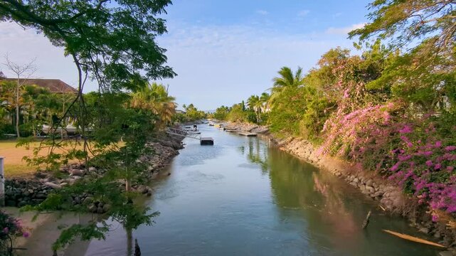 Scenic view time lapse water canal with moored boats on Denarau Island in Nadi, Fiji