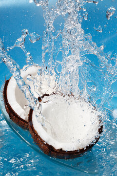 Water splashing on fresh coconuts