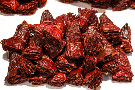 Pile of organic red hot peppers dried and sold on market outside