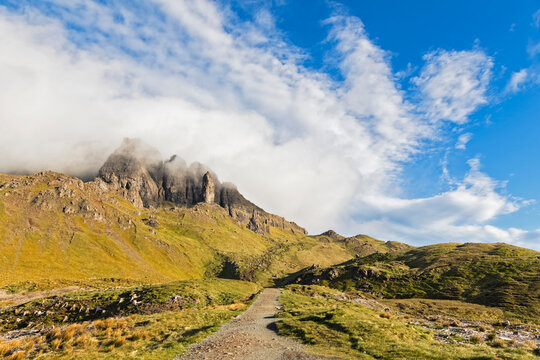 UK, Scotland, Inner Hebrides, Isle of Skye, Trotternish, clouds around The Storr, trail towards observation point