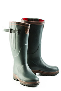 Close up of rubber boots on white background