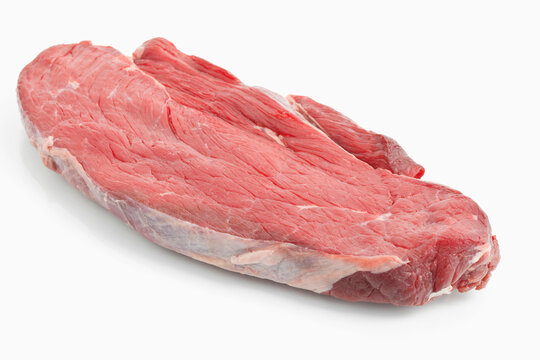 Raw beef on white background, close up