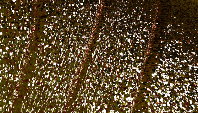 Golden particles create a dynamic abstract wave pattern