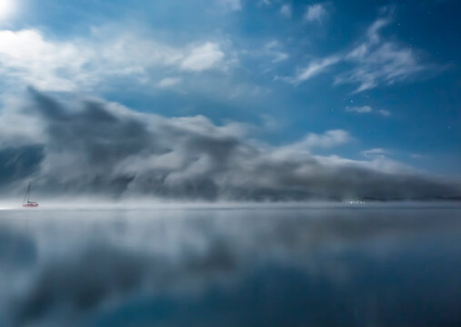 Austria, Mondsee, Lake Mondsee at moonlight with Schober and Drachenwand in the background