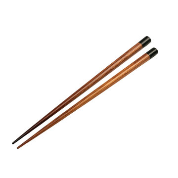 Set of chopsticks on a white background ready for use during a meal or dining experience