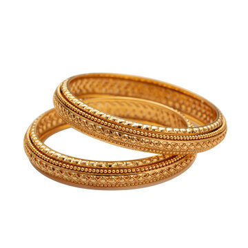 Gold bangles showcasing traditional Indian jewelry style isolated on a plain background