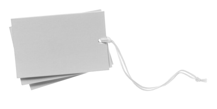 Blank cardboard price tag tied with string flying, isolated on white background, clipping path