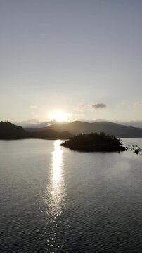 Aerial drone view of Calm tropical waters along the Pangulatan coastline at sunrise