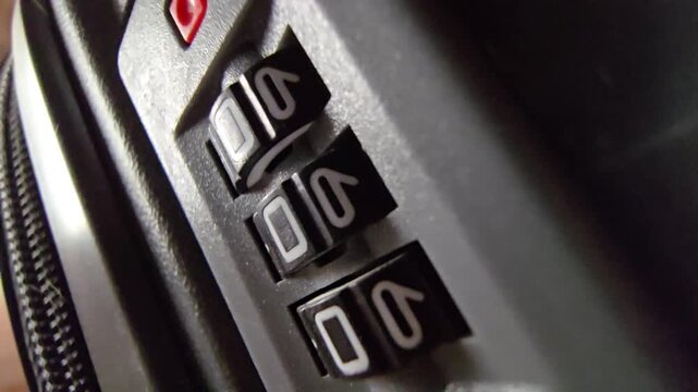 Close-up shot showing the rotating numbers of a mechanical combination lock or secure vault mechanism being changed.