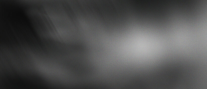 Dark moody abstract background with subtle light glow in center grayscale gradient texture perfect for professional digital design projects and modern website themes.