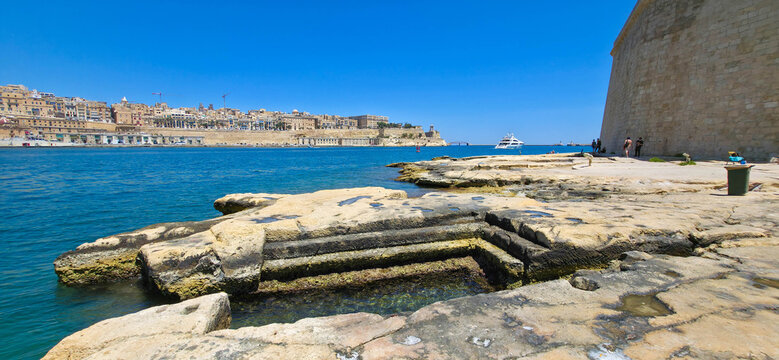 View of Valletta's Grand Harbour from Fort St Angelo Rocky Beach, Vittoriosa (Birgu), Malta