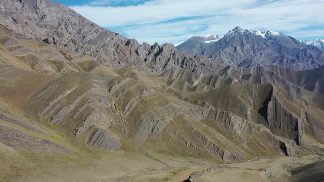 Aerial view of unique folded mountain ranges in Tianshan, Xinjiang