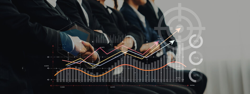 A professional team engages in a business meeting, analyzing growth data and trends, with charts and graphs displayed, capturing the essence of strategy and collaboration. Ledger