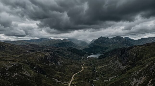 Dramatic mountain landscape featuring stormy skies and beautiful rolling hills in the