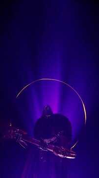 Dynamic Purple and Black Fantasy Motion Background of Animated Warlock Silhouetted by Violet Light