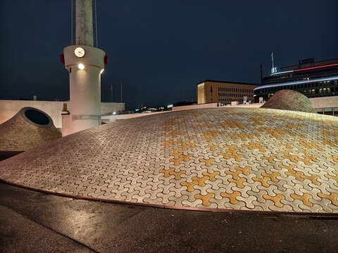 Helsinki, Finland-Nov.30th 2025: night view of Amos Rex Art Museum in Helsinki, tiled dome skylights and tall clock tower.
