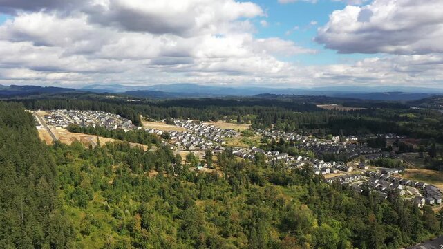 4K aerial drone footage of suburban neighborhood and residential housing in Camas, Washington, USA, showing single family homes, curved streets, real estate development and community layout