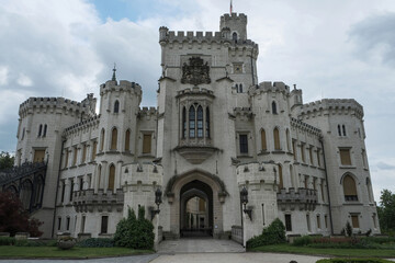 High-quality travel stock photo of famous Hluboka castle main entrance gate. Beautiful white romantic chateau facade in South Bohemia for European landmark tourism catalog. © Jan