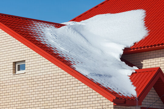 Red roof covered in snow