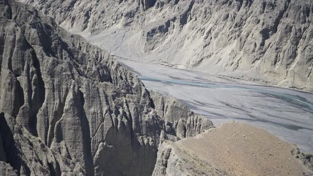 Aerial View of Dushanzi Grand Canyon and Kuitun River in Xinjiang: Winding River, Geological Formations, Mudstone Strata along Duku Highway