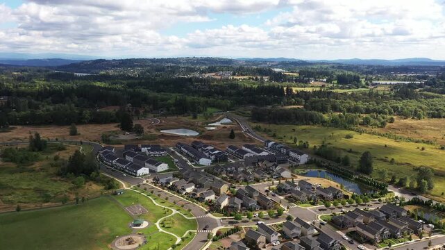 4K aerial drone footage of suburban neighborhood and residential housing in Camas, Washington, USA, showing single family homes, curved streets, real estate development and community layout