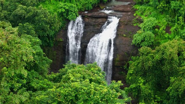 Close-Up View of Ashoka Waterfall Near Nashik, Maharashtra, India, Cascading Monsoon Water Flowing Over Natural Rocky Surfaces Surrounded by Lush Green Vegetation, Scenic Nature Landscape