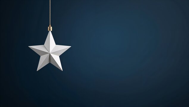 A single white star ornament hangs against a deep blue background, with a hint of metallic gold at its loop