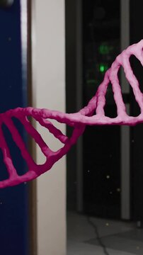 Animation of pink dna strand rotating over computer server room